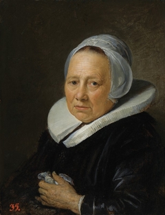 An Old Woman in a White Cap by Gerrit Dou