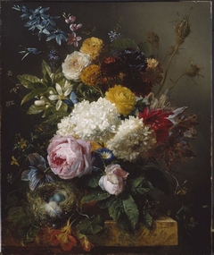 Een boeket bloemen en een vogelnestje op een stenen plint by Georgius Jacobus Johannes van Os