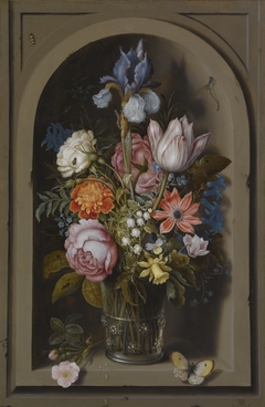 A still life of flowers in a glass beaker by Ambrosius Bosschaert