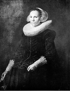 Portrait of a woman with a millstone collar and diadem cap holding gloves in her right hand by Anonymous