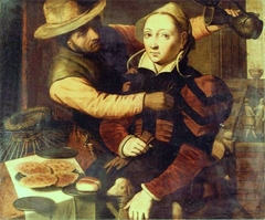 A fisherman making merry with a lady at a table by Pieter Pietersz. I