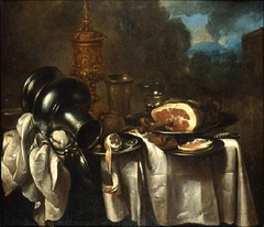 Still life with ham in a landscape by Willem Claesz Heda