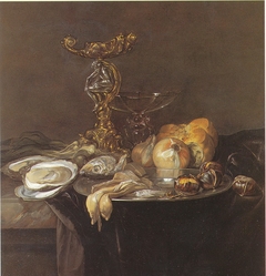 Still life with Orpheus salt cellar, fish, onions, bread, chestnuts and oysters, ca. 1680 by Willem van Aelst