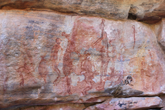 Ancient human figures in red by Anonymous