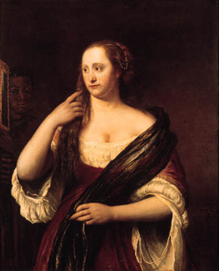 Portrait of a young woman looking into a mirror, holded by a black servant by Philip de Koninck