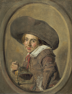 Portrait of a seated young man with a broad brim hat by Frans Hals