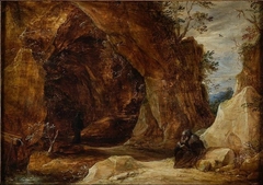 Hermit sitting on a rock next to the entrance of a grotto by David Teniers the Younger