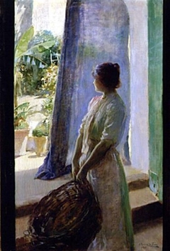 Mujer asomada a la puerta del jardín by Julio Romero de Torres