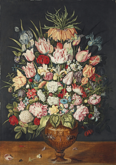 Tulips, roses, a chrysanthemum and other flowers in a sculpted bronze urn by Osias Beert