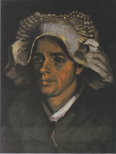 Head of a Peasant woman with white hood by Vincent van Gogh