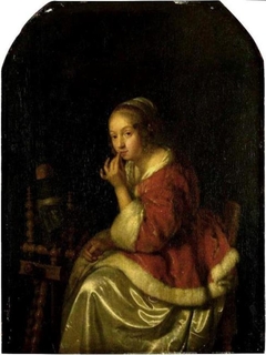 A Lady at a Spinning-wheel by Caspar Netscher