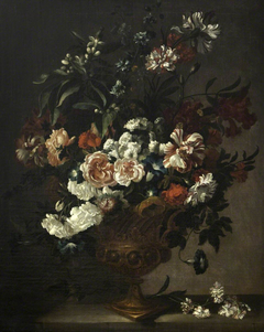 A Bronze Urn with Flowers on a Ledge by Pieter Hardimé