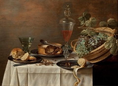 Still life with a wicker basket (Dessert). by Roelof Koets