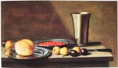 Still life with fruit, bread and a silver chalice by Floris van Schooten