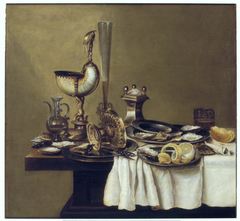 Still life with nautilus cup, tazza and wine glass by Willem Claesz Heda