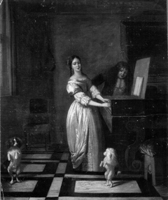 Woman playing the virginal with a man and two dancing dogs by Pieter de Hooch